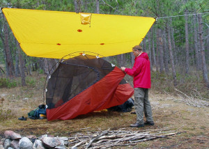 When it's raining, set up a tarp first, then pitch your tent underneath it to keep the tent interior dry. (EasternSlopes.com)