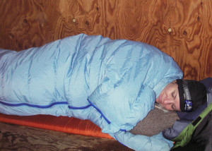 Cozy at last! Unable to get the cabin comfortably warm, we retreated early to winter sleeping bags and spent the long night in perfect comfort. Getting up in the morning was tougher . . .