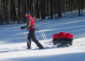 A pulk-and-harness system is one way to haul the gear you need in winter. This Nordic Cab pulk from Norway converts to a child carrier  for cross-country skiing or a wheeled cart or jogging stroller in the summer. (EasternSlopes.com)