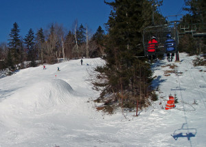 Black snow! Just four days after a major January rainstorm, Black Mountain had plenty of snow on its snowmaking trails. And the  “classic” double and triple chairs limit the number of skiers and snowboarders to scrape it off. (Tim Jones EasternSlopes.com)