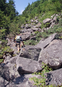 Boulder-hopping in the Ice Gulch. This is one of the most challenging trails in the region. (Tim Jones/EasternSlopes.com photo)