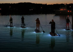 SUP paddling at night  on Oak Bluffs Harbor with Island Spirit Kayaking: lights on the bottom of our Stand-Up Paddleboards made the experience almost dream-like as we floated between sea and sky with fish, crabs, and starfish swimming beneath. (Island Spirit Kayaking )