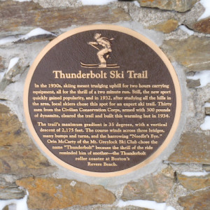 This plaque gave us some of the history of the trail we had just climbed. Note the snow driven deep into the crevices of the stonework by the wind. (Tim Jones/EasternSlopes.com)