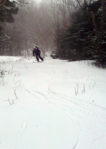 Nicole Simms enjoys sliding down the Gulf Of Slides ski trail in Pinkham Notch, NH, turns she earned by skinning up the trail earlier. (Danielle Jepson/Appalachian Mountain Club)