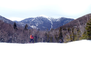 There’s a stream below all that snow, a frozen waterfall over the edge, and a fabulous view of Algonquin and others of the High Peaks beyond. (EasternSlopes.com photo)