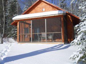 A view of Cabin two from the back reveals a lovely screened in porch, perfect for summer dining. (Marti Mayne/EasternSlopes.com)