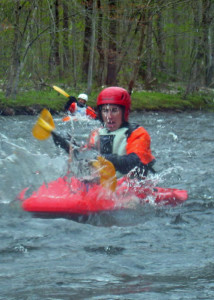 Getting splashed with freezing cold water is just part of the fun of learning how to whitewater kayak. (EasternSlopes.com)