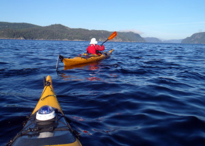 Paddling from the boat launch at Anse de Roche toward Cap Ste. Marguerite (on the right) on Saguenay Fjord. We were on the lookout for whales but didn't see any on this morning paddle. (EasternSlopes.com)