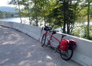 Every inch of the first 10 miles of pedaling from Sainte Rose du nord was uphill. When we finally started down and found this lovely little lake besise the road, we were happy to stop for a few minutes. (Tim Jones/EasternSlopes.com