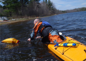 Instructor Vaughan Smith demonstrates how even a big gguy can get himself back into a flipped kayak. Every serious kayaker should take a rescue and re-entry course, practice, and then make sure they never need to do it for real. (EasternSlopes.com)