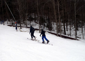 This father-and-son duo of uphillers were in synch as the skinned up "Cruiser" a designated Uphill route on South Peak at Loon Mountain on New Year's Day 2015. (EasternSlopes.com)