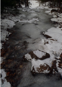 Thaws, rains and re-freezes can leave hiking trails looking more like slanted skating rinks. Winter hiking without traction aids can be treacherous. (EasternSlopes.com)