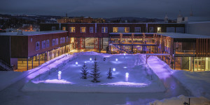 The hotel courtyard is ringed by a skating track and centers a modern, amenity rich ski-and-stay experience. (Le Massif photo)